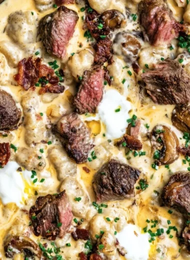 Loaded steak and gnocchi skillet meal served in a pan