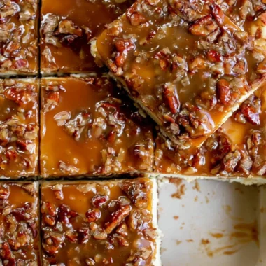 Delicious pecan pie cheesecake bars topped with caramel and pecans