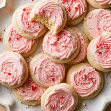 A plate of peppermint meltaway cookies topped with crushed candy canes.