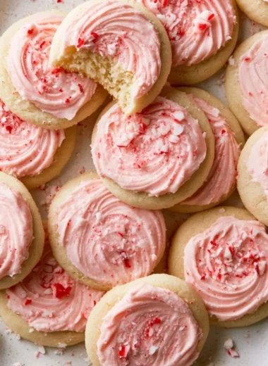 A plate of peppermint meltaway cookies topped with crushed candy canes.
