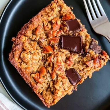 Delicious protein baked oatmeal topped with chocolate chunks in a bowl