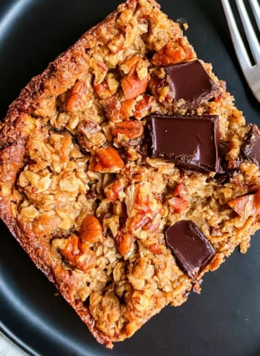 Delicious protein baked oatmeal topped with chocolate chunks in a bowl