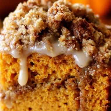 Slice of Pumpkin Streusel Coffee Cake topped with a buttery streusel crust.