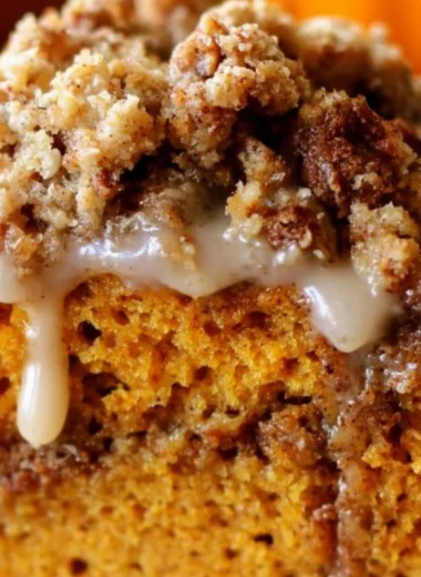Slice of Pumpkin Streusel Coffee Cake topped with a buttery streusel crust.